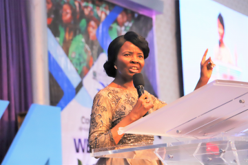 Pastor Faith Oyedepo speaking at a Women's Fellowship meeting