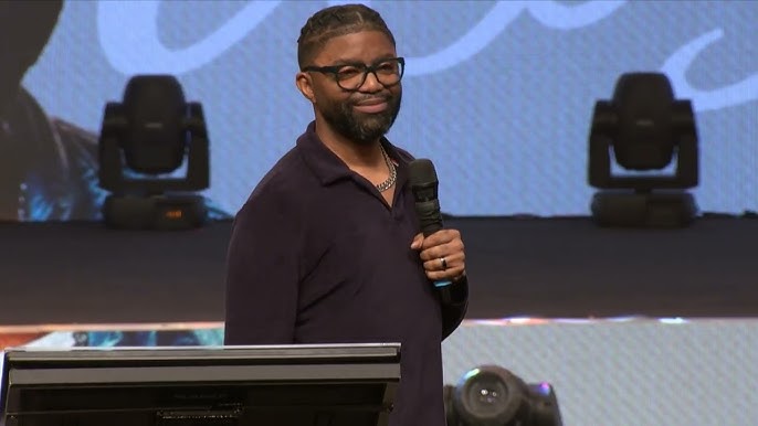 Tim Ross speaking on stage at a ministry conference
