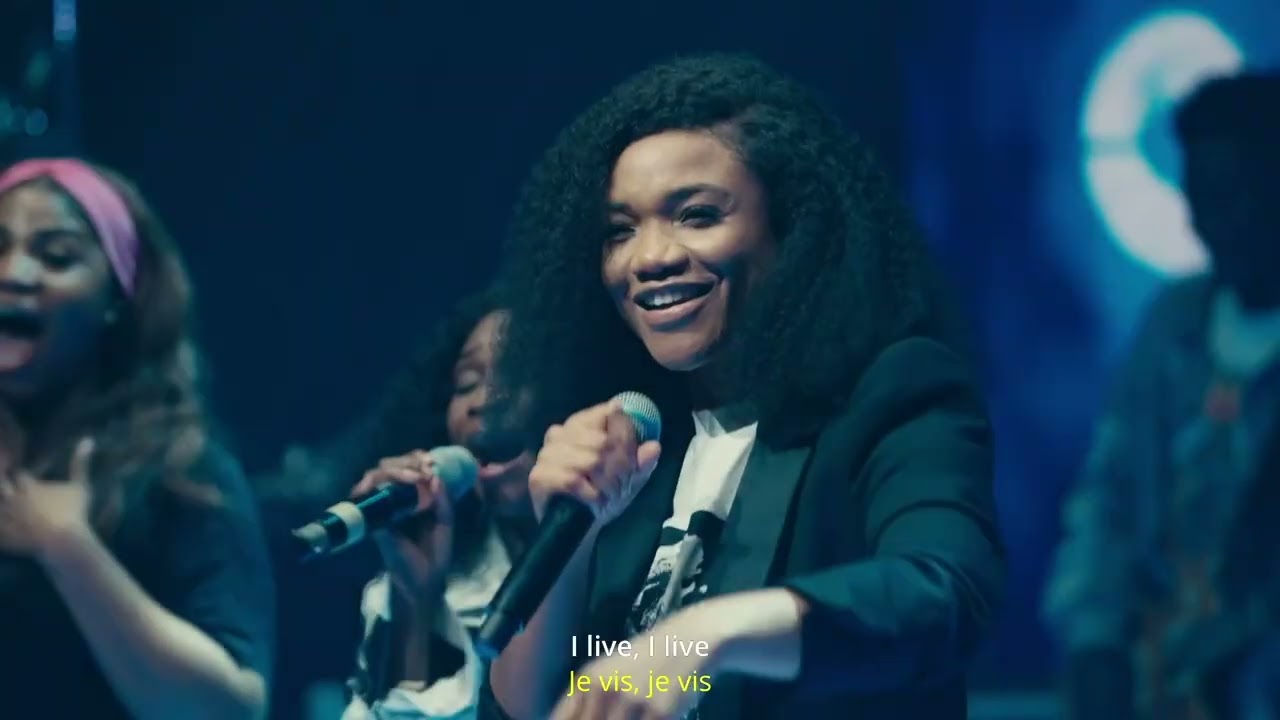 Ada Ehi performing on stage at a gospel concert