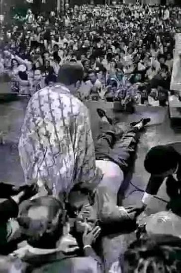 Benson Idahosa at a crusade praying for the sick