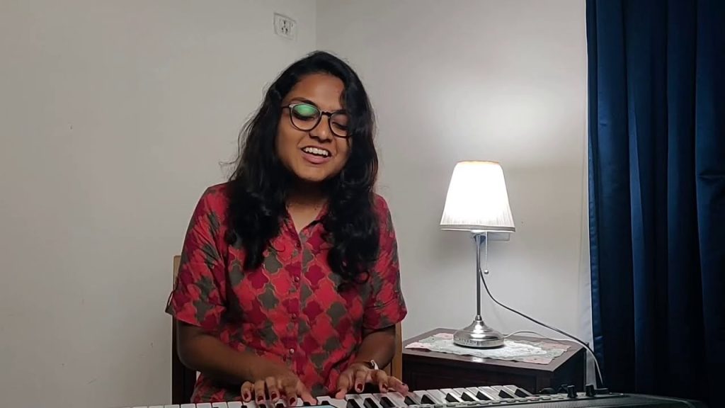 Prakruthi Angelina playing keyboard during a worship set
