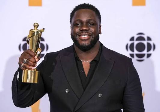 Ryan Ofei holding his JUNO Award trophy